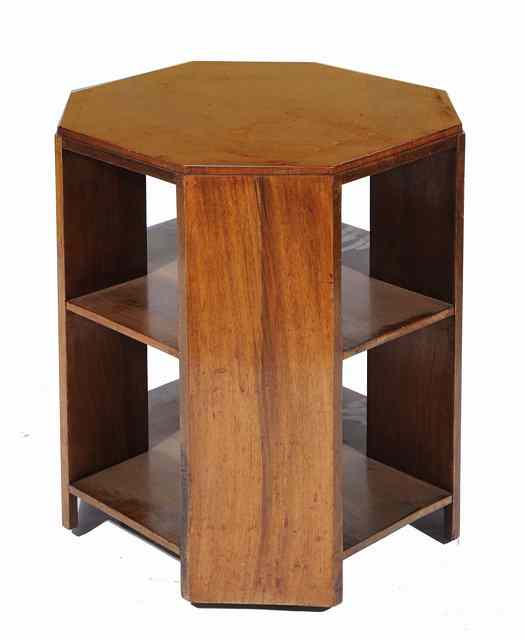 Appraisal: A Heals walnut two tier octagonal occasional table on castors