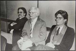 Appraisal: Photo of Andy Warhol Depicted seated between two men cased