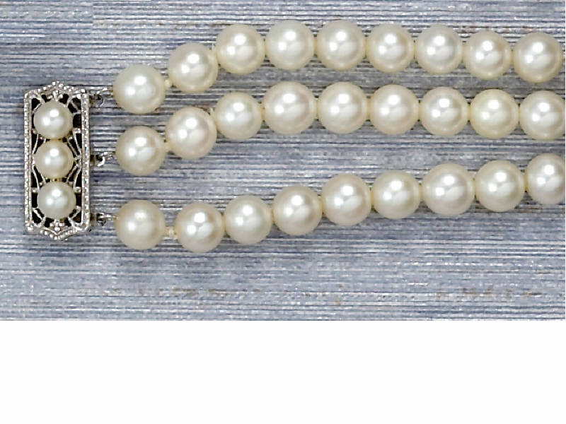 Appraisal: PEARL BRACELET Triple strand design with mm cultured pearls and