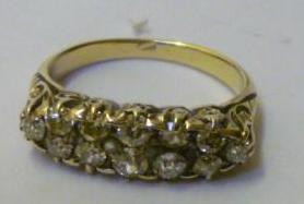 Appraisal: A DIAMOND RING having twelve round cut diamonds set in