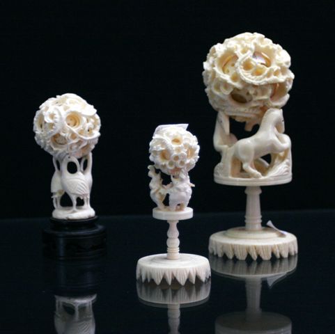 Appraisal: Five oriental puzzle balls and stands in ivory bone and