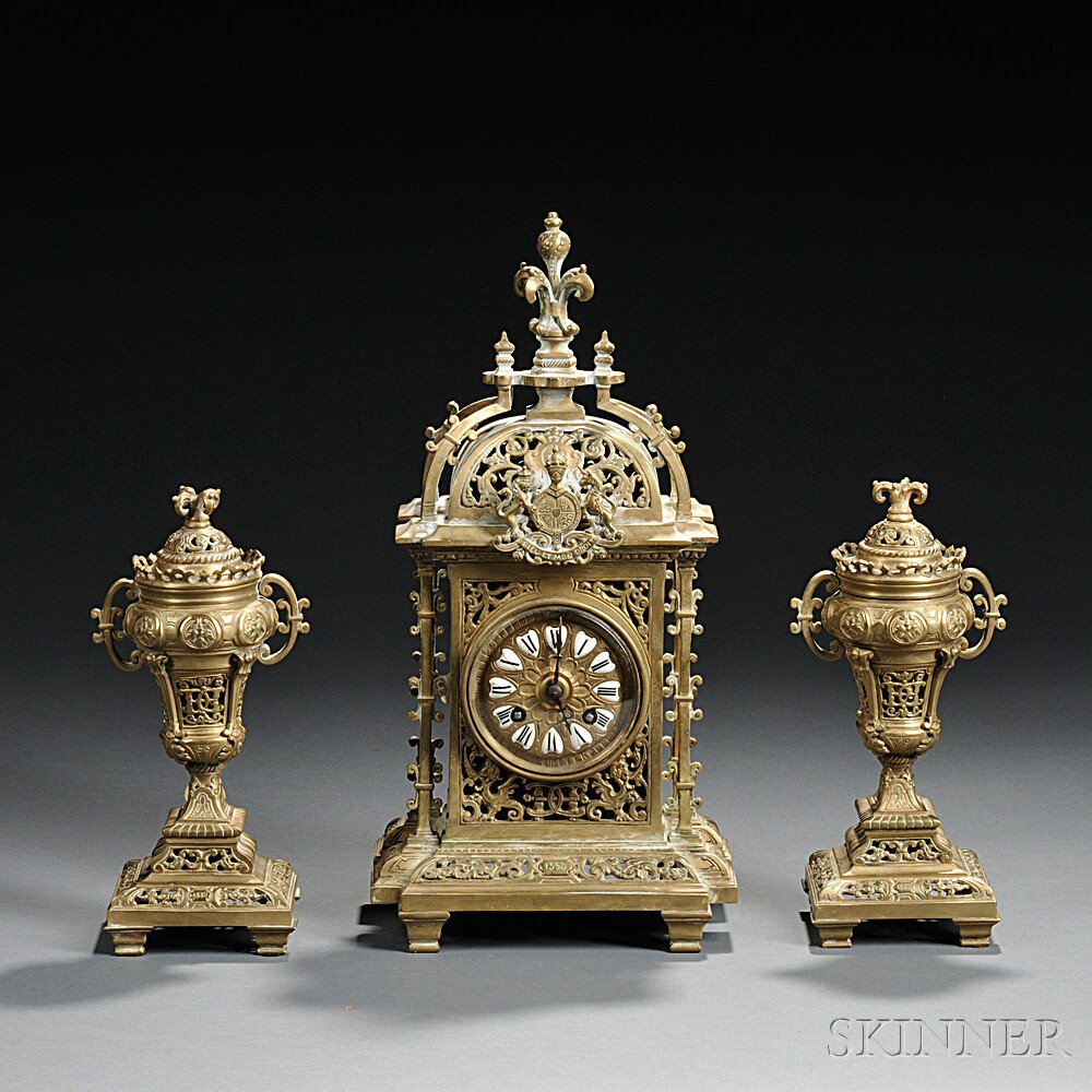 Appraisal: French Renaissance Revival Brass Clock and Garniture Set late th