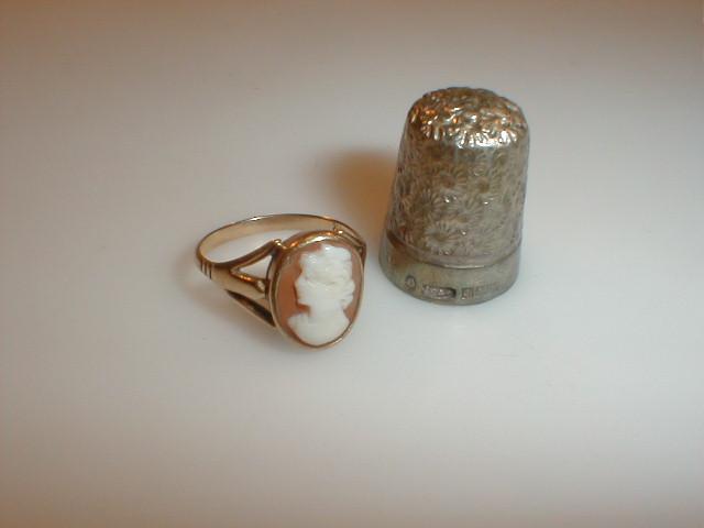 Appraisal: A floral decorated silver thimble Birmingham together with a shell