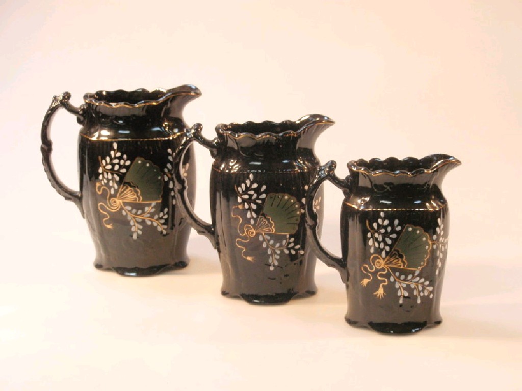 Appraisal: Three Jackfield type pottery water jugs