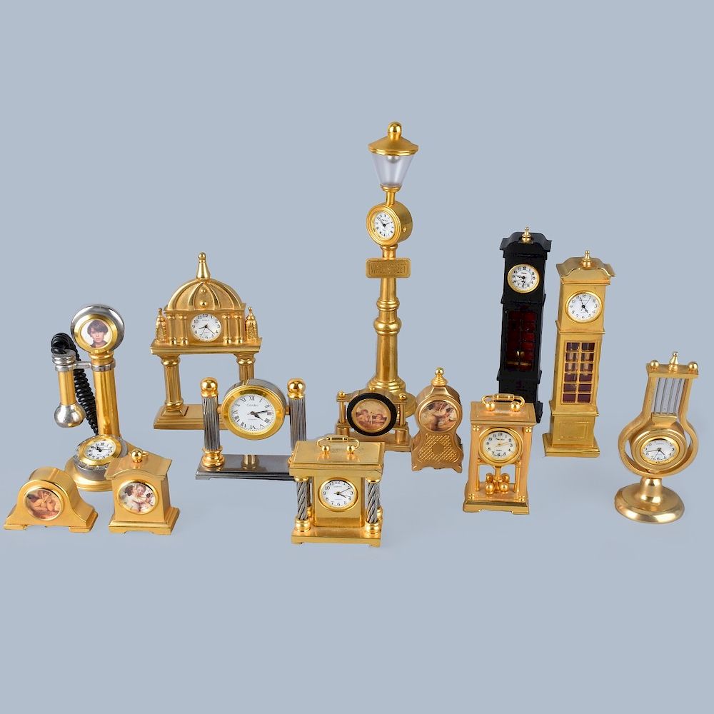 Appraisal: Miniature Brass Clocks Collection of thirteen miniature brass and cast