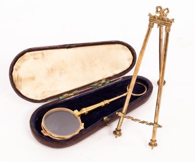 Appraisal: A pair of gold coloured metal pince-nez with spring action