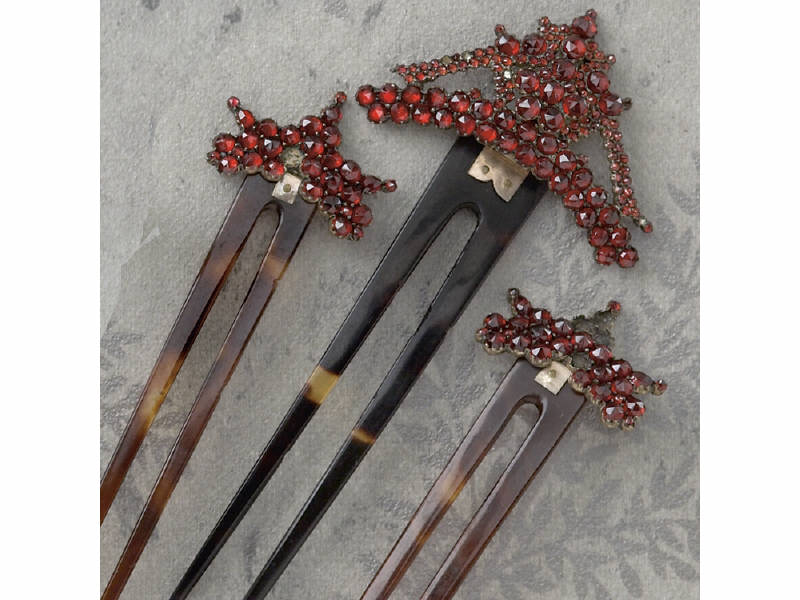 Appraisal: ANTIQUE GARNET AND TORTOISE SHELL HAIR COMBS Three late Victorian