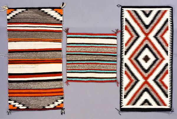 Appraisal: Three Navajo textiles Two rugs and a saddle blanket size