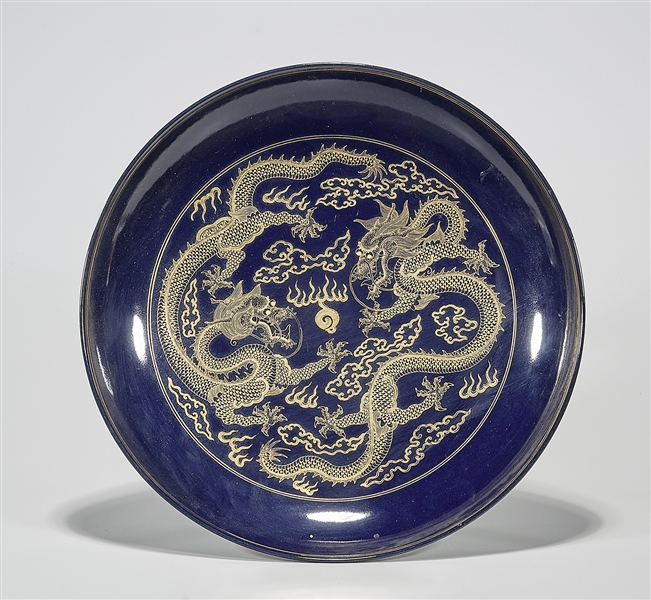 Appraisal: Chinese glazed porcelain charger with gilt design of dragons chasing