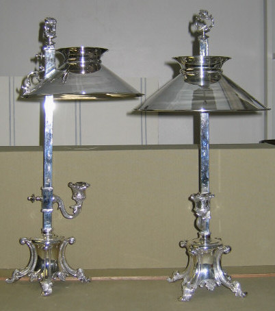 Appraisal: PAIR OF SHEFFIELD PLATED SILVER STUDENT CANDLE LAMPS Four-sided standards