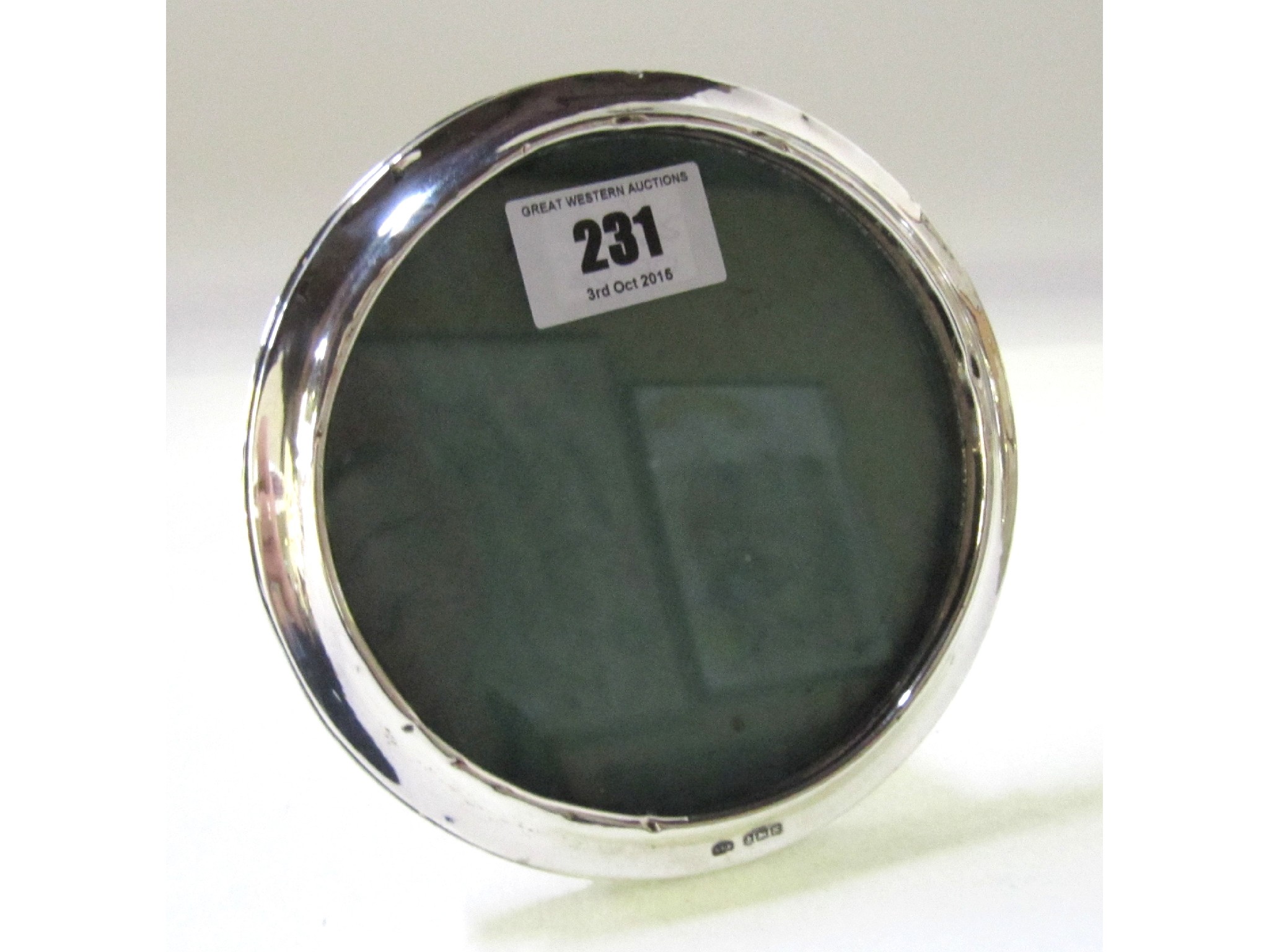 Appraisal: A circular silver mounted photo frame Birmingham