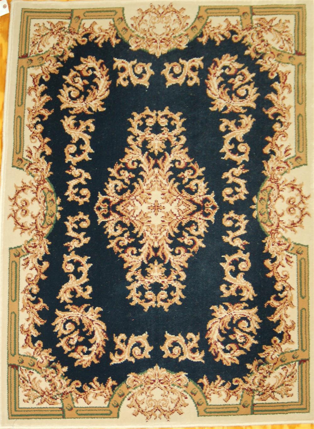 Appraisal: AUBUSSON STYLE MACHINE MADE SYNTHETIC ORIENTAL RUG having a navy