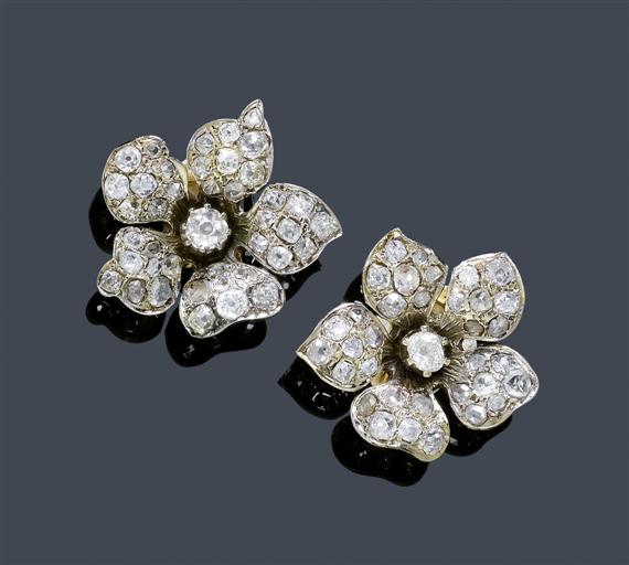 Appraisal: DIAMOND EAR CLIPS circa Platinum on yellow gold Charming flowerhead