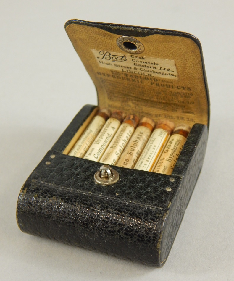 Appraisal: An unusual small leather box containing tabloid form hypodermic products