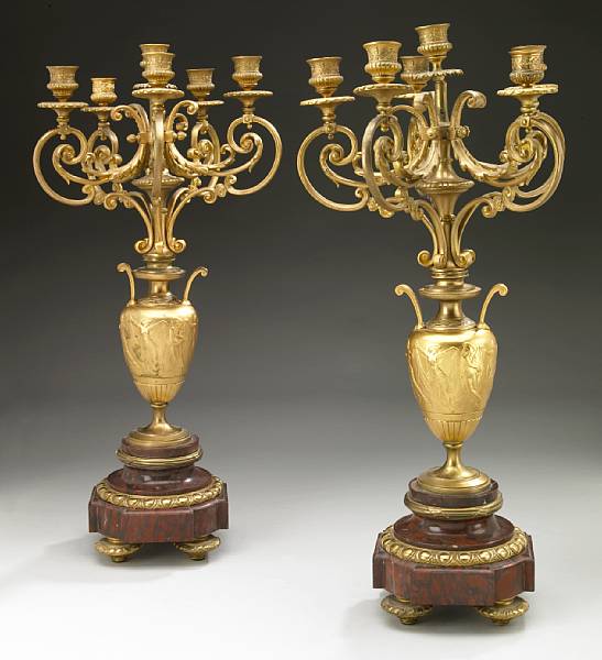 Appraisal: A pair of French gilt bronze and rouge marble six