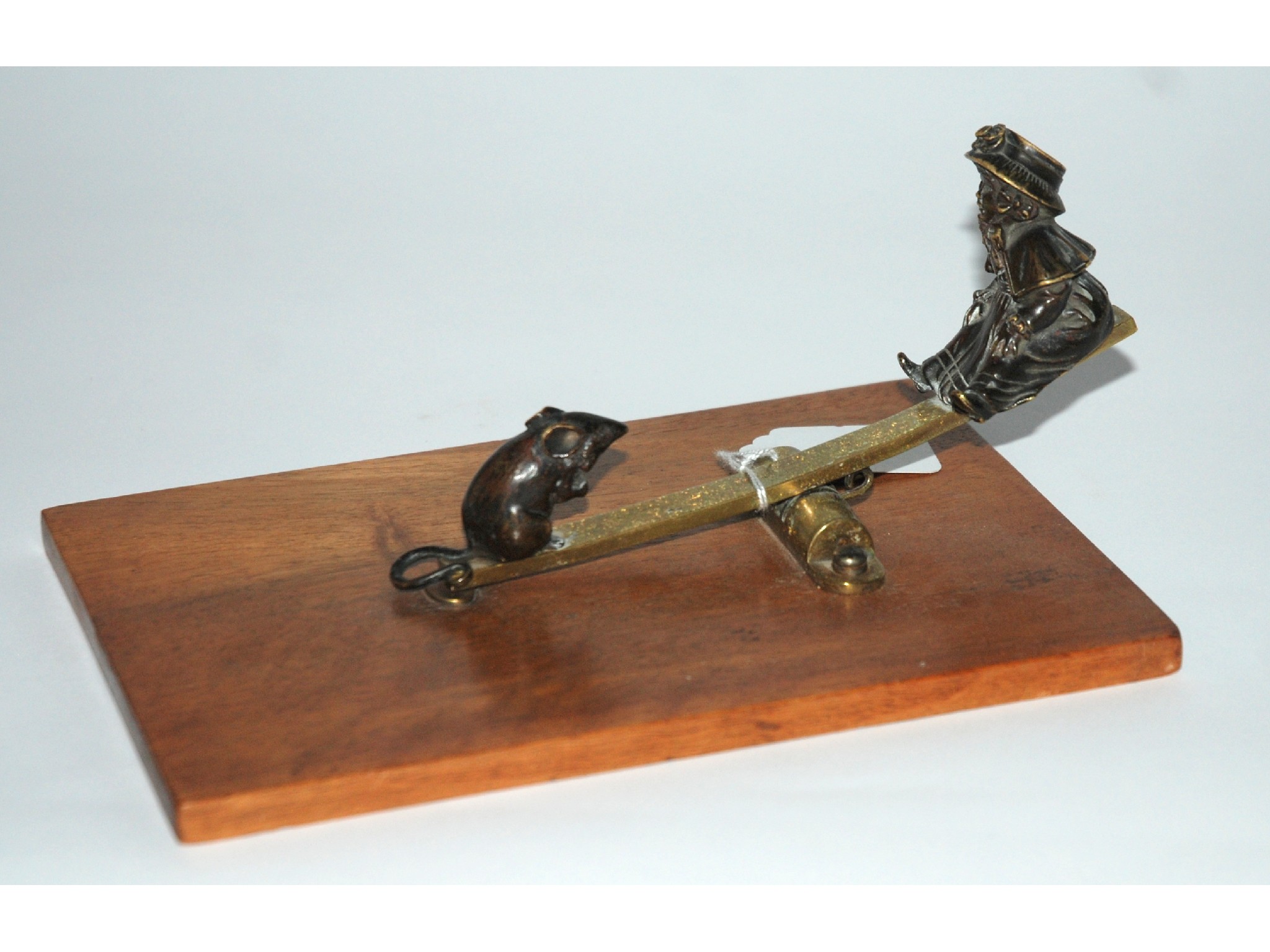 Appraisal: A bronze letter clip modelled as a young girl and