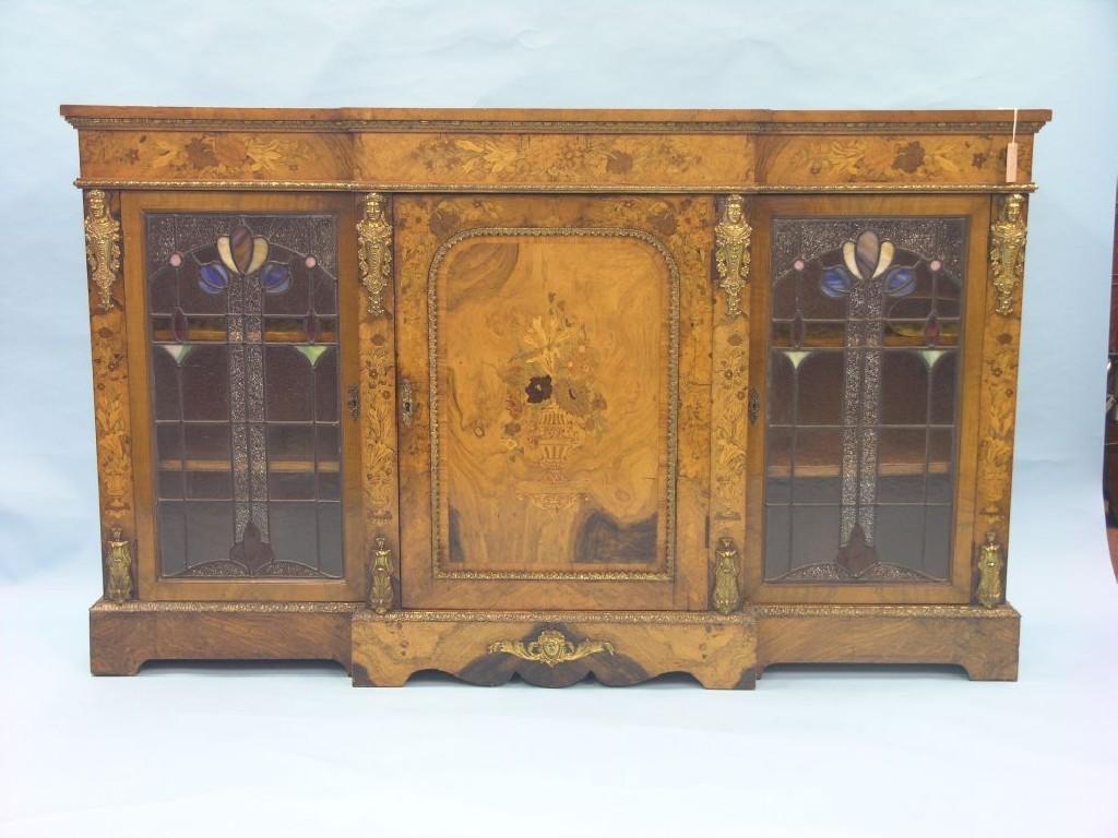 Appraisal: A Victorian burr walnut and marquetry credenza break-fronted with ormolu