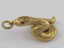 Appraisal: A hallmarked ct gold diamond and ruby serpent pendant Approx