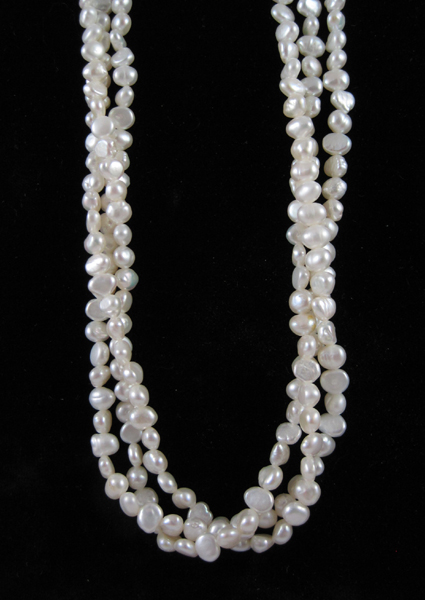 Appraisal: TRIPLE-STRAND BAROQUE PEARL NECKLACE with three twisted strands of baroque