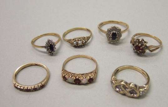 Appraisal: A gold ruby and diamond set half hoop ring an