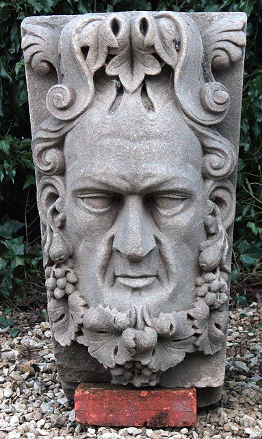 Appraisal: A LARGE CARVED SANDSTONE KEY STONE with mask of a