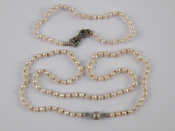 Appraisal: A cultured pearl necklace with a white metal tests carat