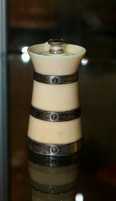 Appraisal: An ivory and silver banded pepper millLondon