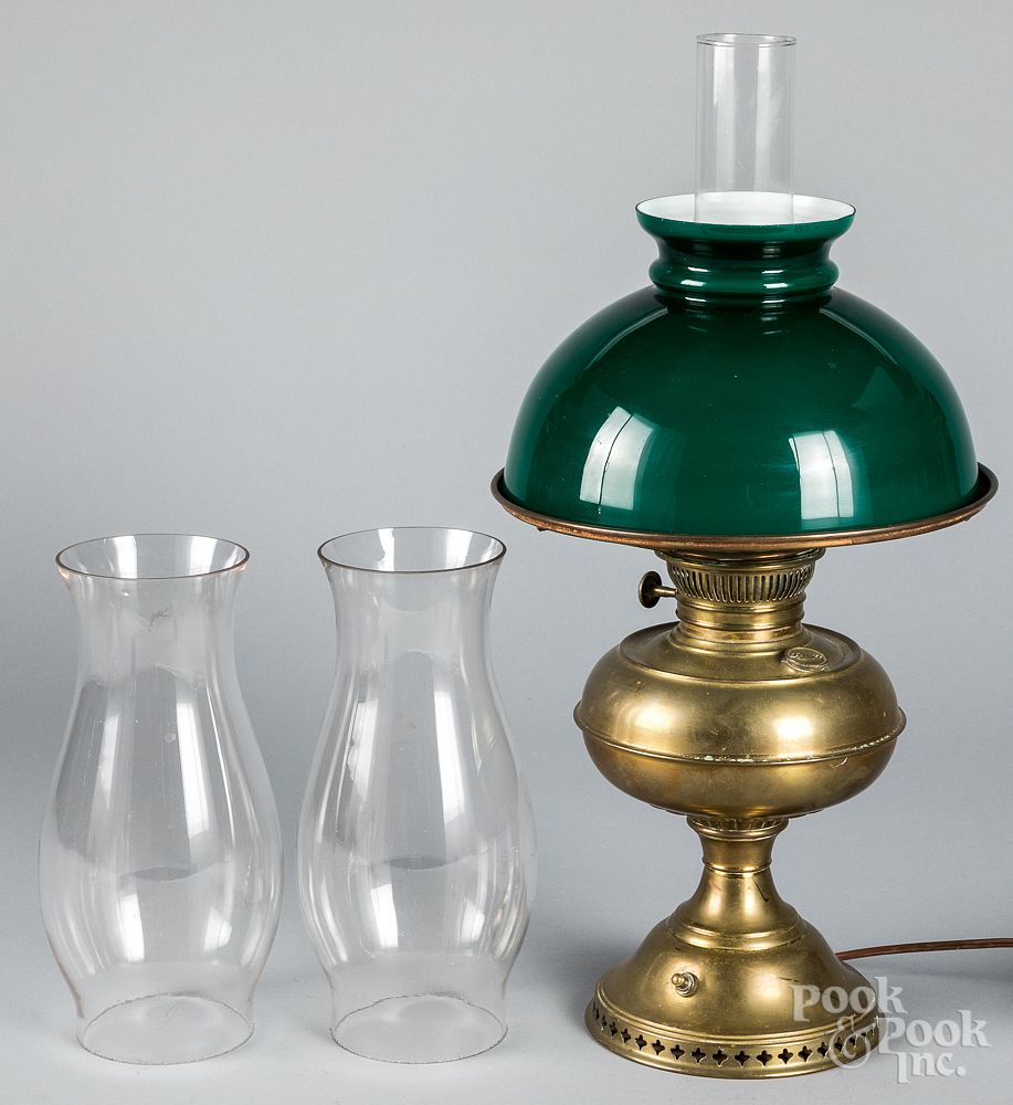 Appraisal: Brass fluid lamp and a pair of hurricane shades Brass