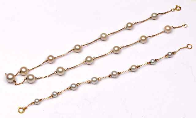 Appraisal: A CULTURED PEARL AND CHAIN NECKLACE with thirteen interspersed graduated