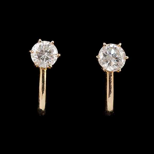 Appraisal: Diamond Earclips A pair of K yellow gold and diamond