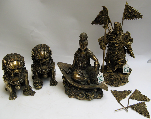 Appraisal: FOUR GILT BRONZE AND BRASS FIGURES a seated Buddhist figure