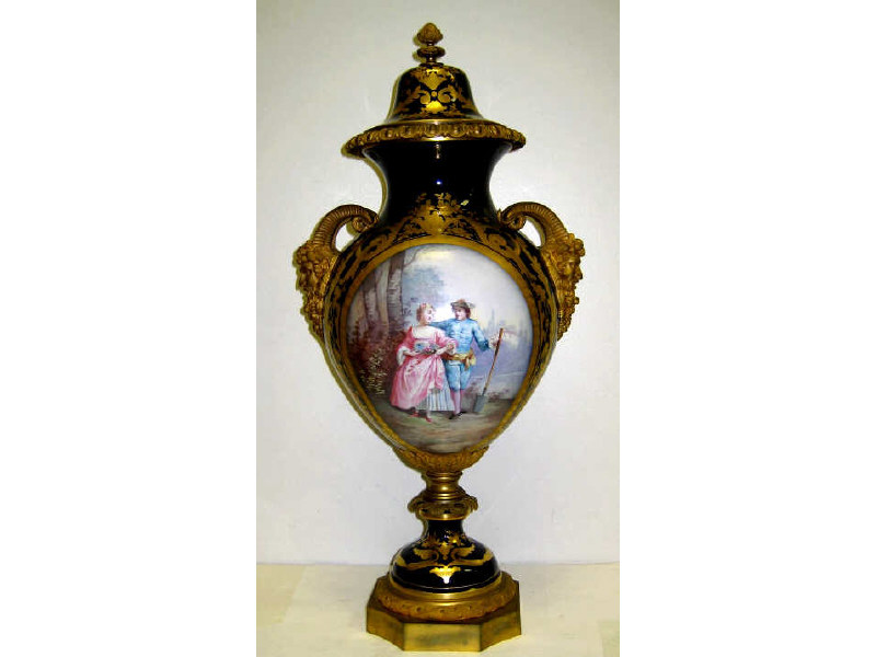 Appraisal: FRENCH SEVRES STYLE PORCELAIN LIDDED URN Gilt metal mountings and