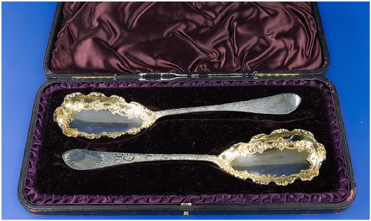 Appraisal: Cased Pair Of Victorian Silver Berry Spoons With Embossed Scroll