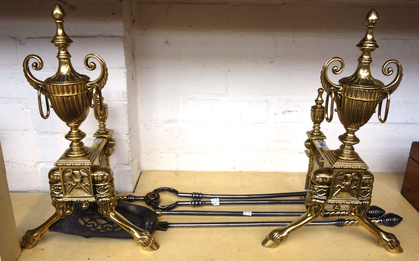 Appraisal: A pair of Victorian Adams urn style andirons raised on