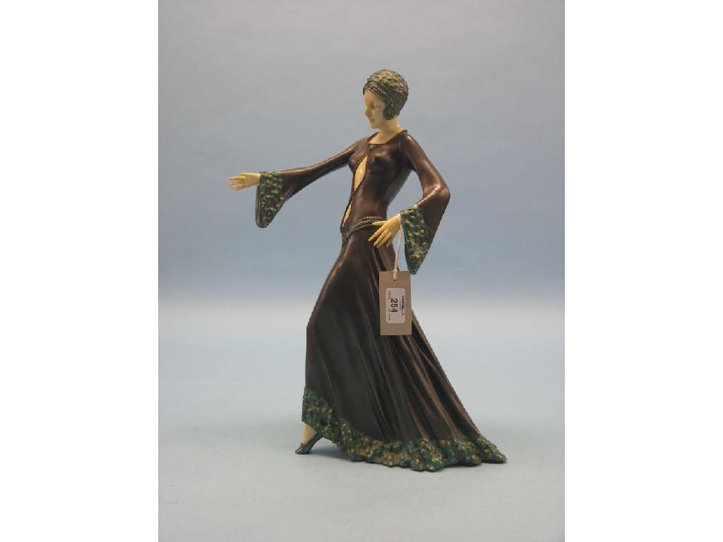 Appraisal: An Art Deco-style statuette female dancer in long evening dress