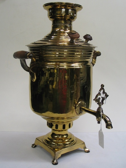 Appraisal: A RUSSIAN BRASS SAMOVAR with wood handles original spigot with