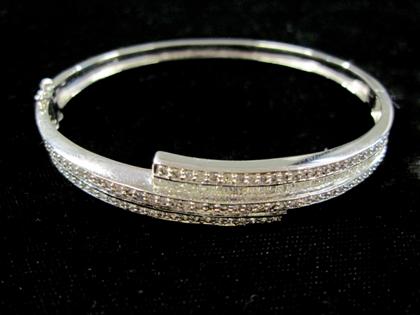 Appraisal: karat white gold and diamond bangle braceletThree rows of petite