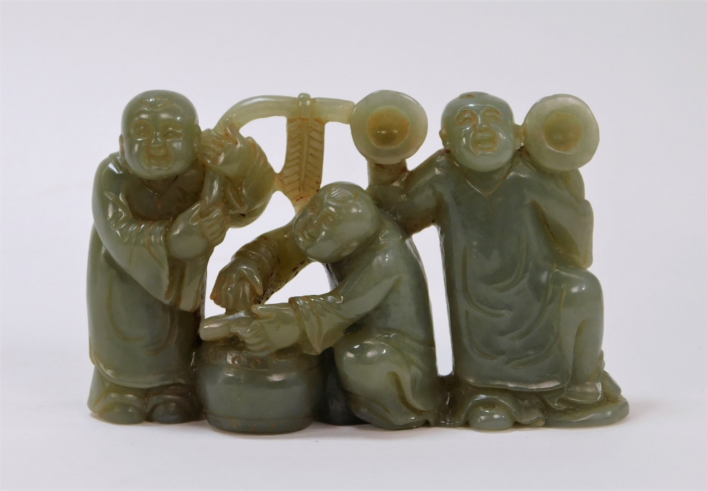 Appraisal: CHINESE HARDSTONE CELADON CARVING OF FIGURES China th centuryDepicting three