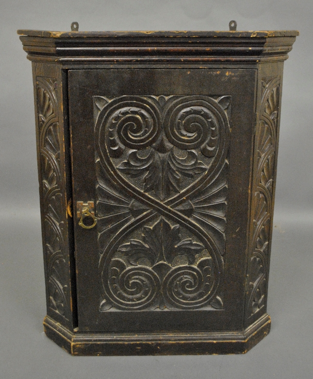 Appraisal: - Carved Continental hanging corner cupboard h x w -