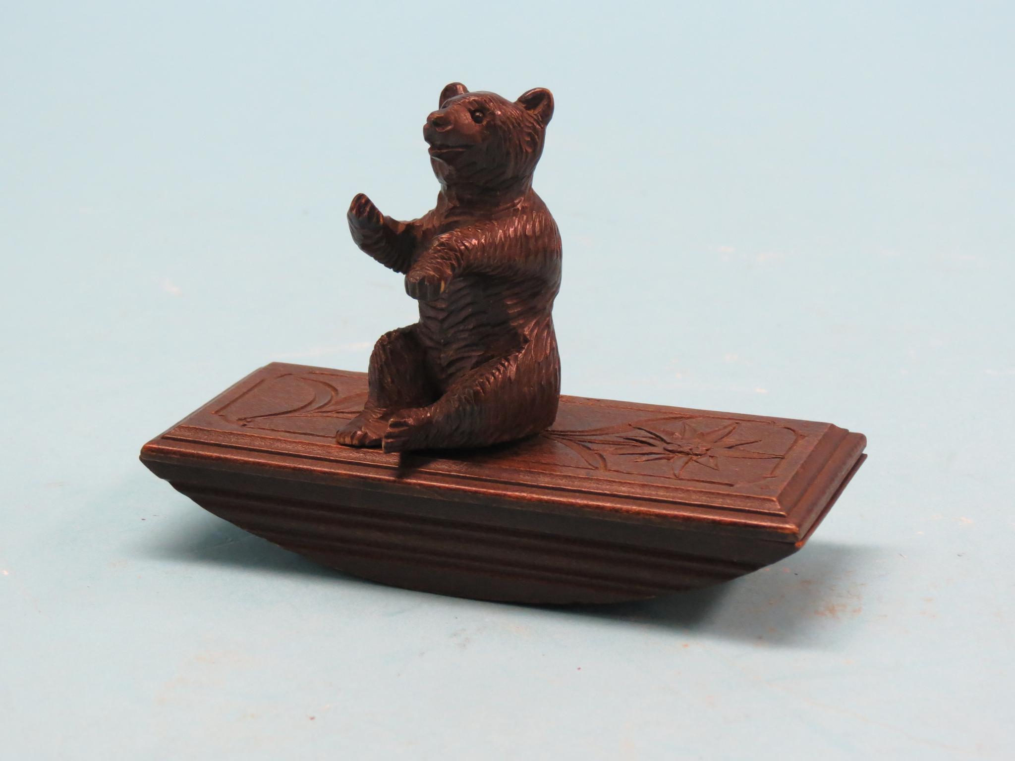 Appraisal: A Swiss carved wood novelty ink blotter with seated bear