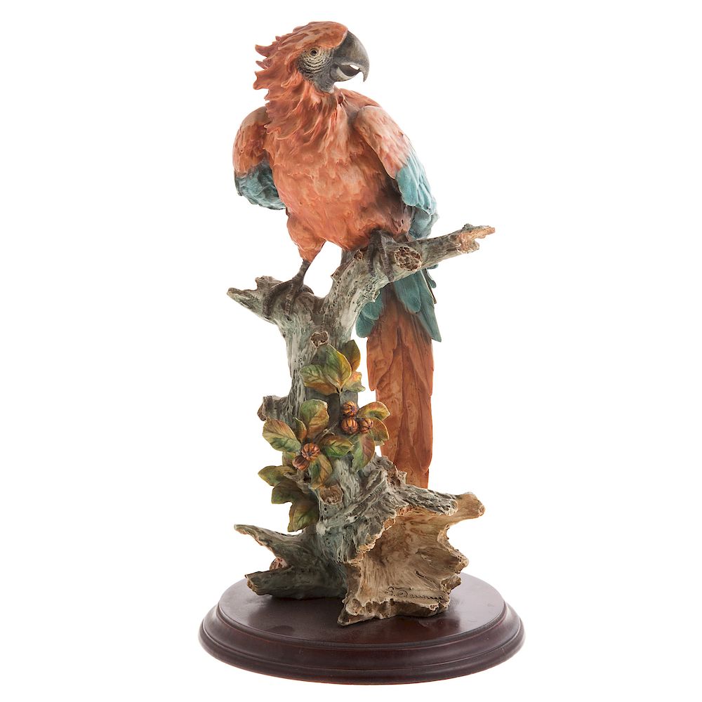 Appraisal: Guiseppe Armani Scarlet Macaw colorful parrot perched on floral laden