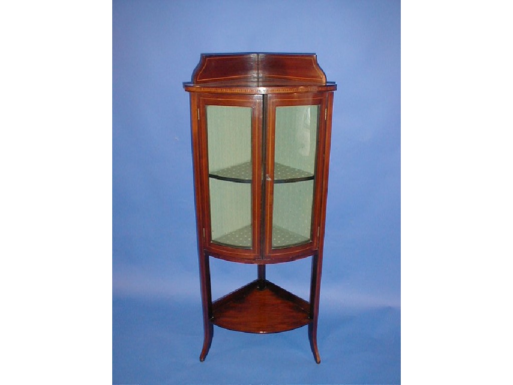 Appraisal: An Edwardian string inlaid mahogany corner display cabinet with two