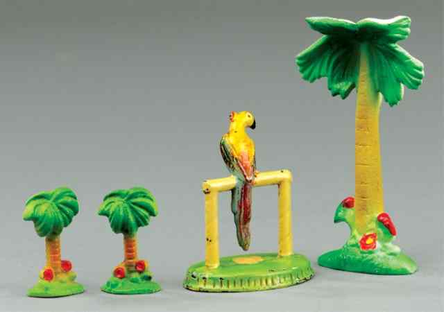 Appraisal: PALM TREES AND PARROT PAPER WEIGHTS Cast iron colorful grouping