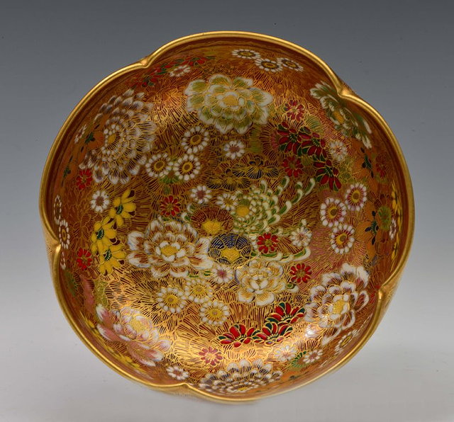 Appraisal: A KYOTO SATSUMA BOWL with petal rim decorated with a