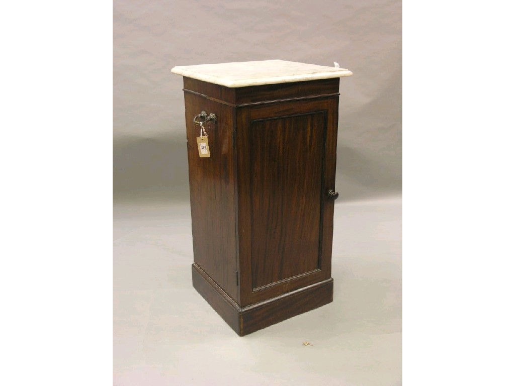 Appraisal: A Victorian mahogany bedside cupboard with white marble top cast