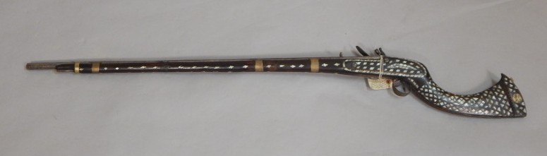 Appraisal: An Eastern North West Frontier flintlock musket the lock plate