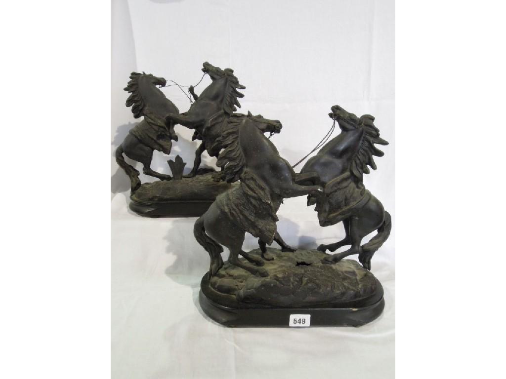 Appraisal: A pair of spelter groups of Marley horses