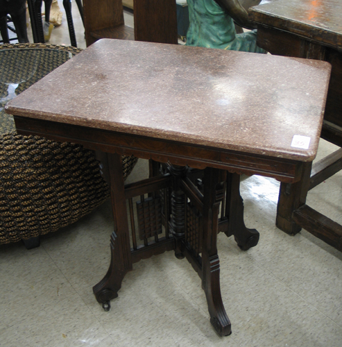 Appraisal: A VICTORIAN MARBLE-TOPPED WALNUT LAMP TABLE Eastlake design American c