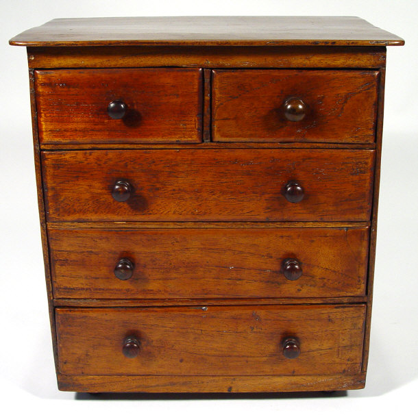 Appraisal: Victorian walnut apprentice chest of drawers fitted two short above