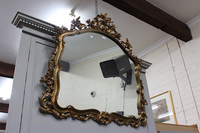 Appraisal: A GEORGIAN STYLE GILT MIRROR with arching top the frame